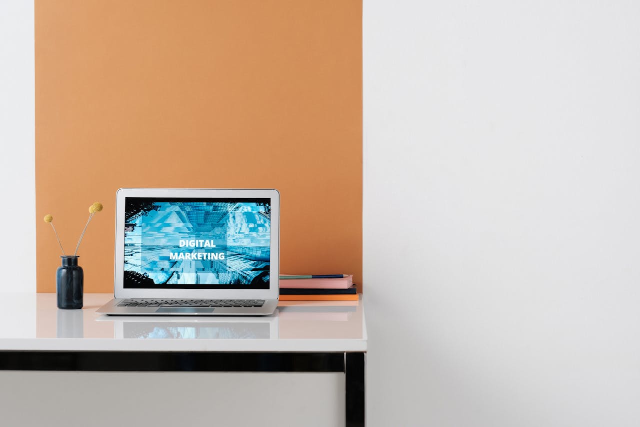 who-we-are A clean, modern workspace featuring a laptop with digital marketing on screen, ideal for business use.